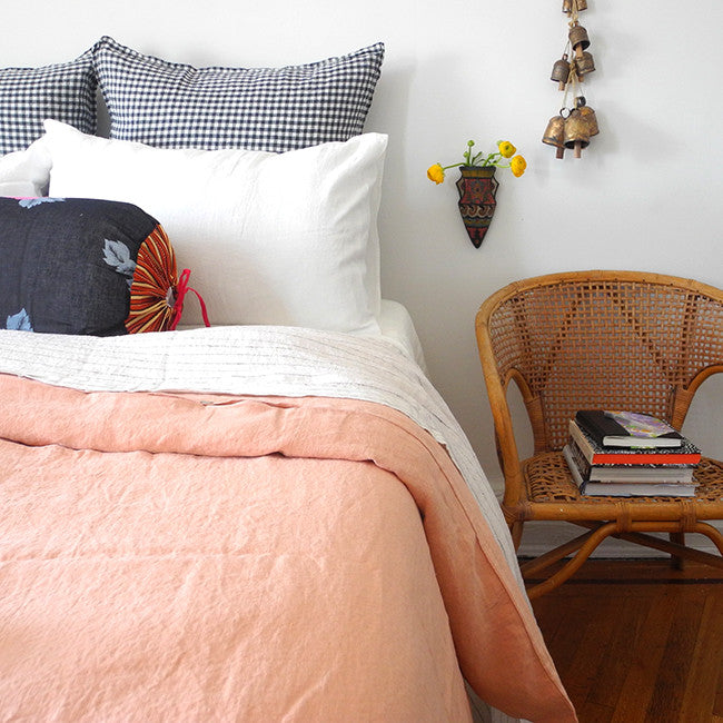 A Linge Particulier Linen Duvet in Copper gives a salmon and pink color to this duvet for a colorful linen bedding look from Collyer&#39;s Mansion