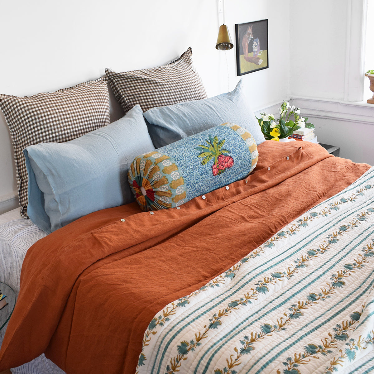 A Linge Particulier Linen Duvet in Sienna gives a orange and rust color to this duvet for a colorful linen bedding look from Collyer's Mansion