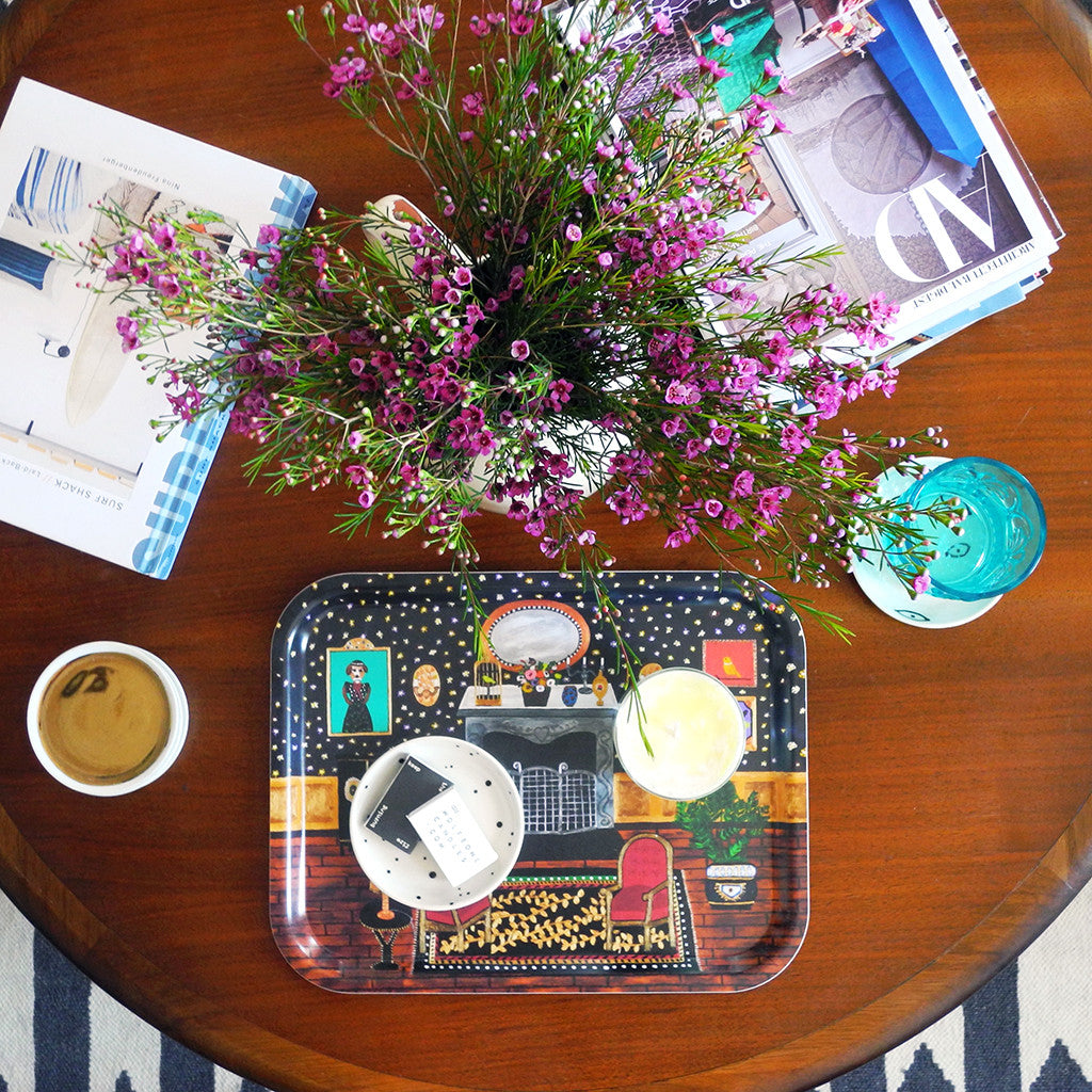 Designer tray with home interiors painting pattern on a coffee table with flowers and books - Collyer's Mansion