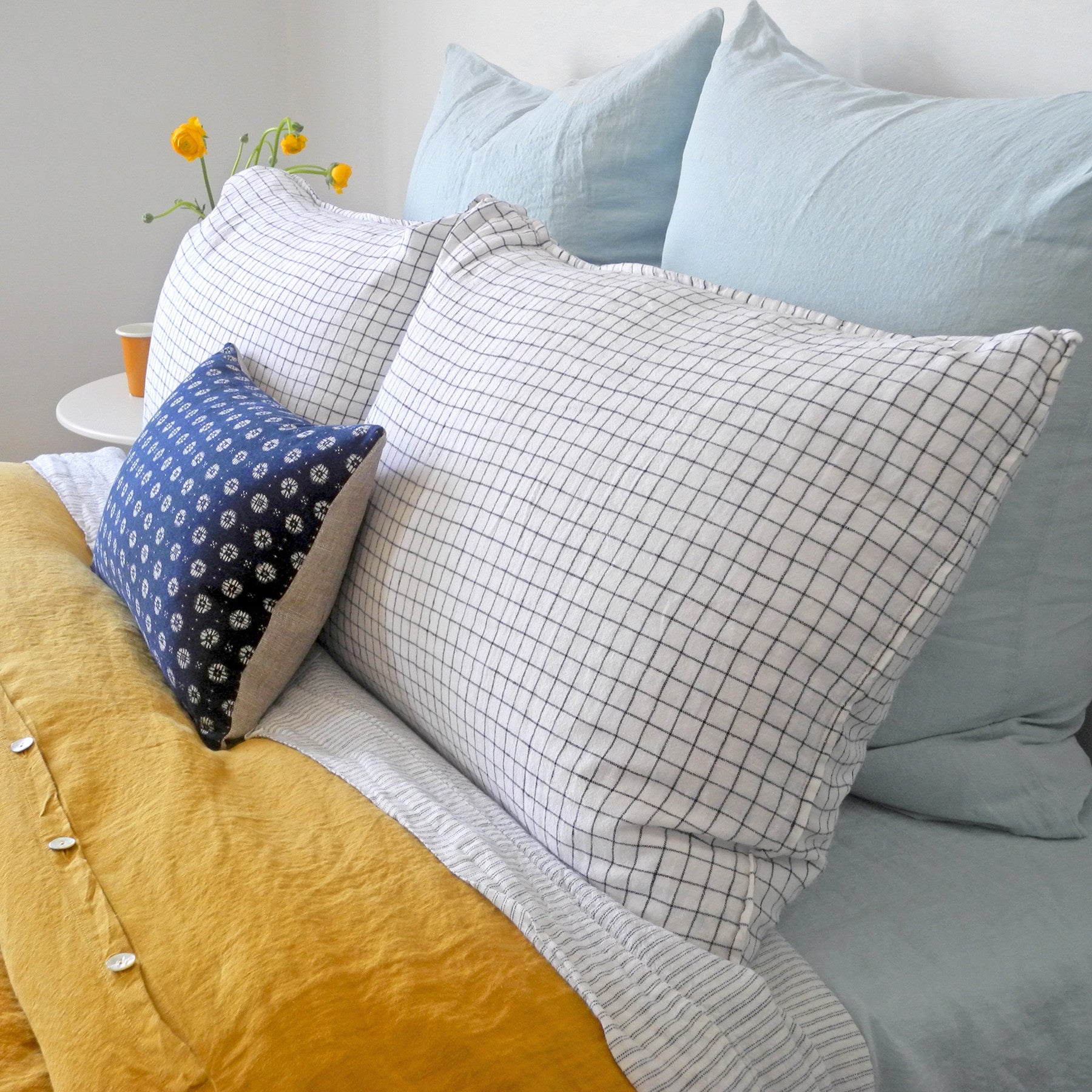 Linge Particulier Pale Blue Euro Linen Pillowcase Sham with a honey yellow linen duvet for a colorful linen bedding look in light blue - Collyer&#39;s Mansion