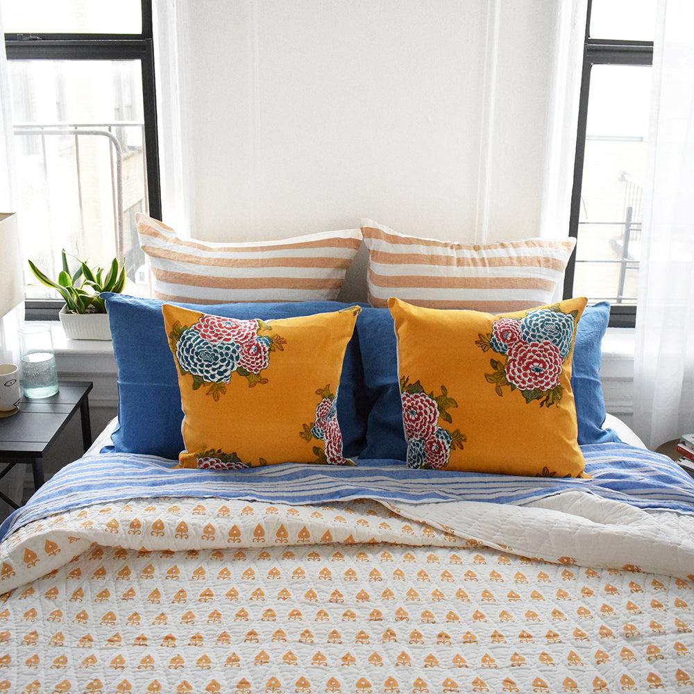 Block printed quilt in mustard yellow handmade by Serendipity Delhi for colorful bedding at Collyer&#39;s Mansion