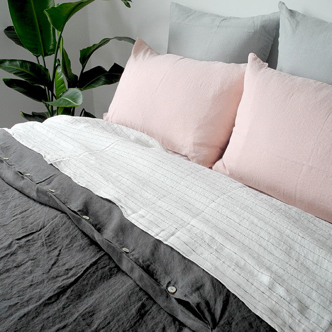 Linge Particulier Cloud Grey Euro Linen Pillowcase Sham with a charcoal linen duvet and nude pink pillowcases for a colorful linen bedding look in light grey - Collyer&#39;s Mansion