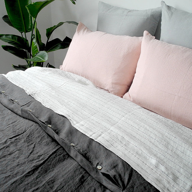 Linge Particulier Cloud Grey Euro Linen Pillowcase Sham with a charcoal linen duvet and nude pink pillowcases for a colorful linen bedding look in light grey - Collyer's Mansion