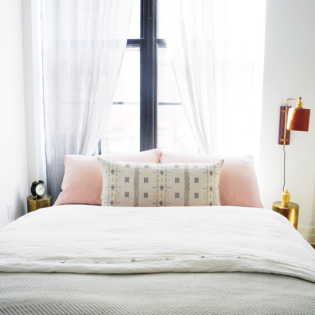 Linge Particulier Nude Standard Linen Pillowcase Sham with a Coral & Tusk pillow for a colorful linen bedding look in soft blush pink - Collyer's Mansion