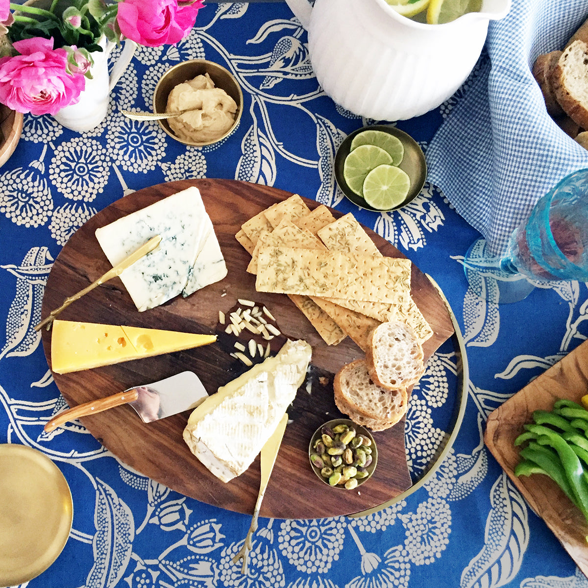 Fog Linen Round Brass Tray on Utopia Goods tablecloth with serveware and food - Collyer&#39;s Mansion