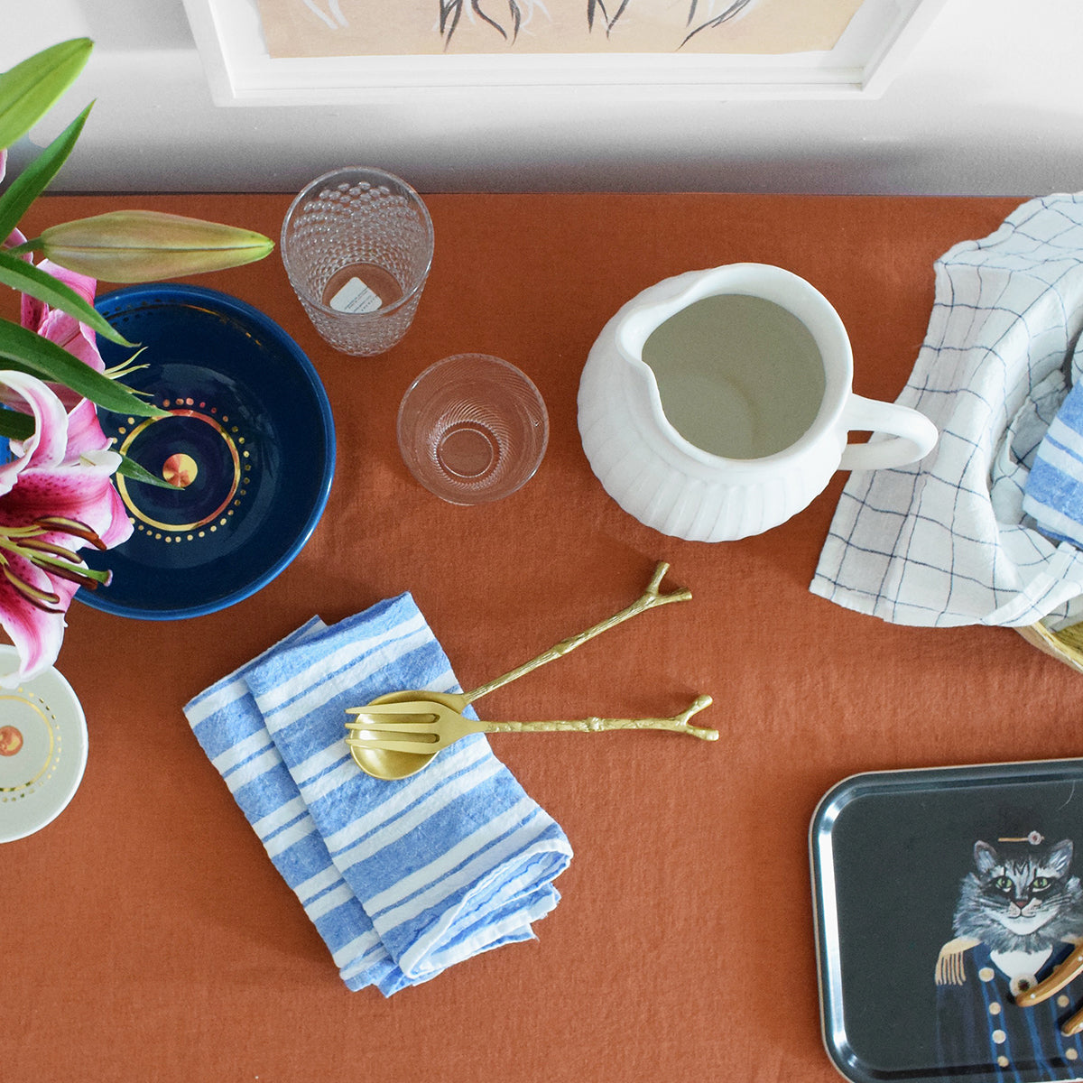 Rectangle designer tray in Scandinavian tray style with a black background and cat portrait on sienna tablecloth with dining set up - Collyer's Mansion