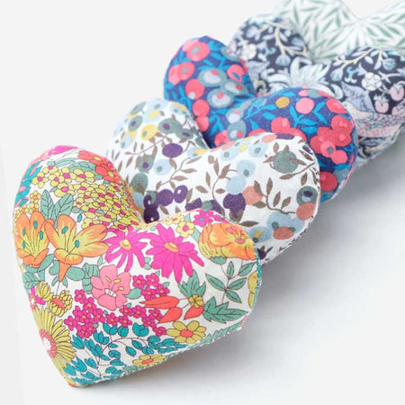a group of colorful heart shaped pillows