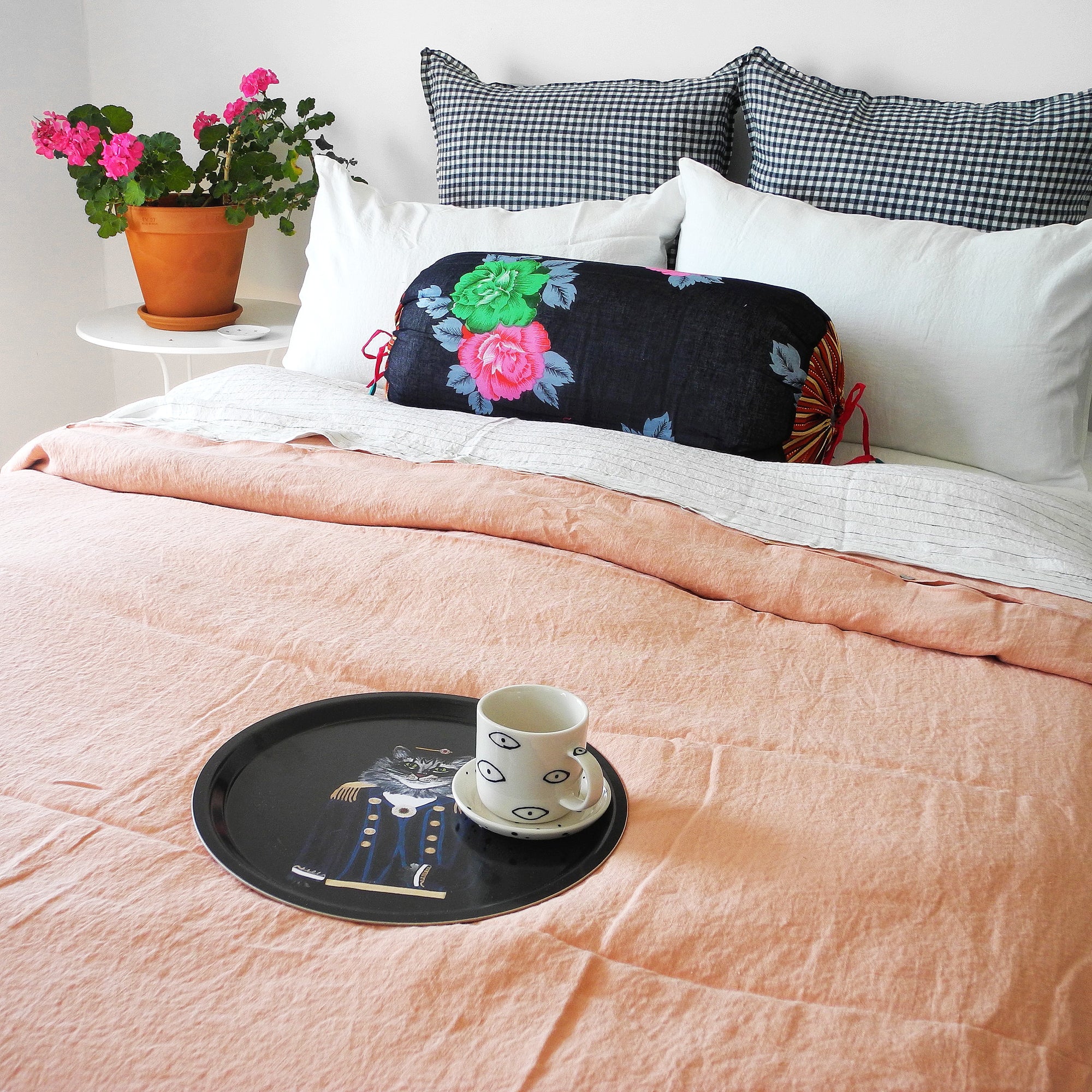 A Linge Particulier Linen Duvet in Copper gives a salmon and pink color to this duvet for a colorful linen bedding look from Collyer&#39;s Mansion