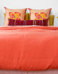 A Linge Particulier Linen Duvet in Terracotta gives a vibrant orange and sunset color to this duvet for a colorful linen bedding look from Collyer's Mansion