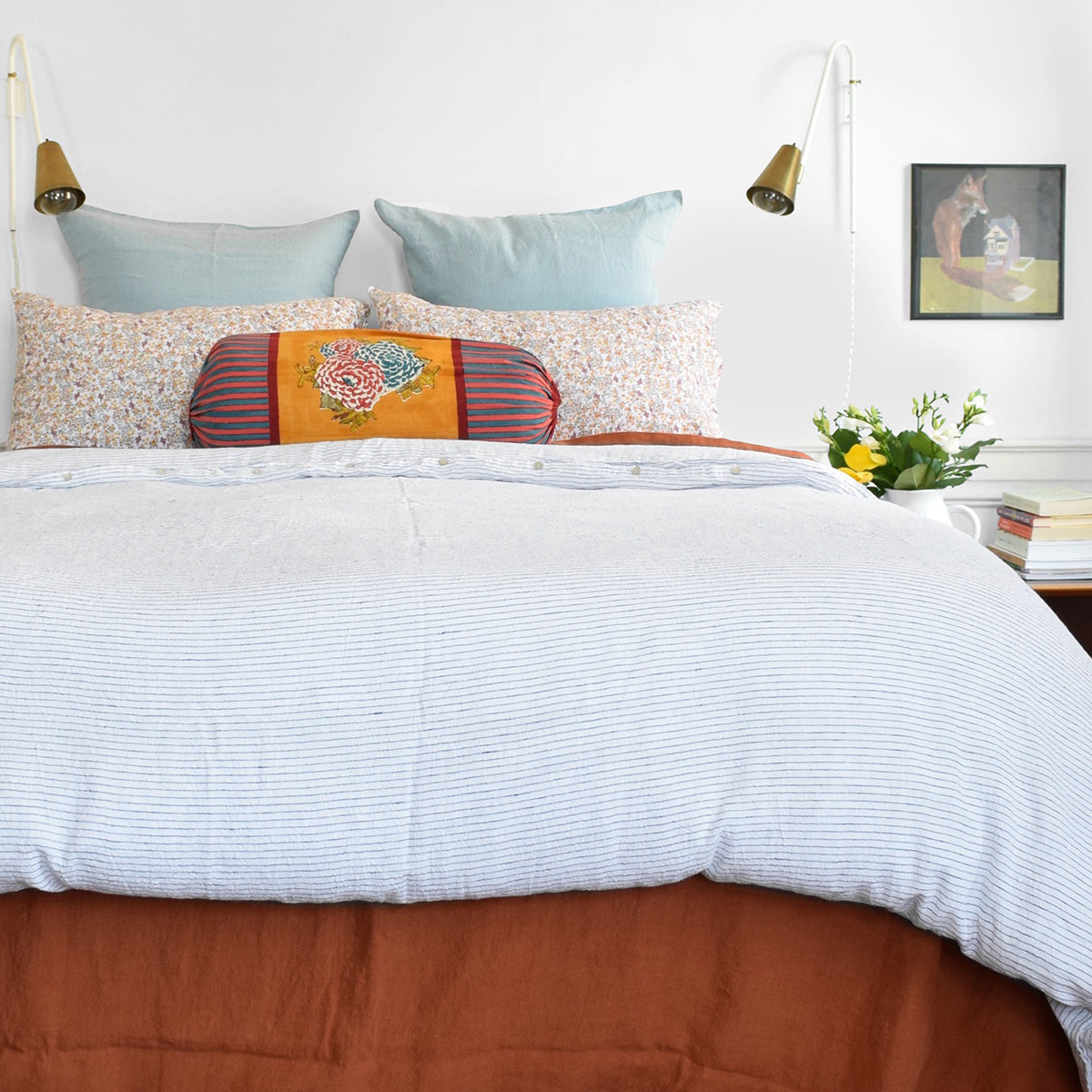 A Linge Particulier Linen Duvet in Atlantic Blue Stripe gives a white and blue pinstripe color to this duvet for a sky blue patterned and printed linen bedding look from Collyer&#39;s Mansion