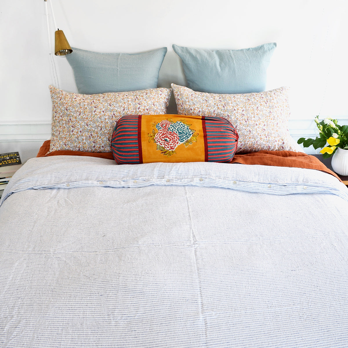 A Linge Particulier Linen Duvet in Atlantic Blue Stripe gives a white and blue pinstripe color to this duvet for a sky blue patterned and printed linen bedding look from Collyer&#39;s Mansion