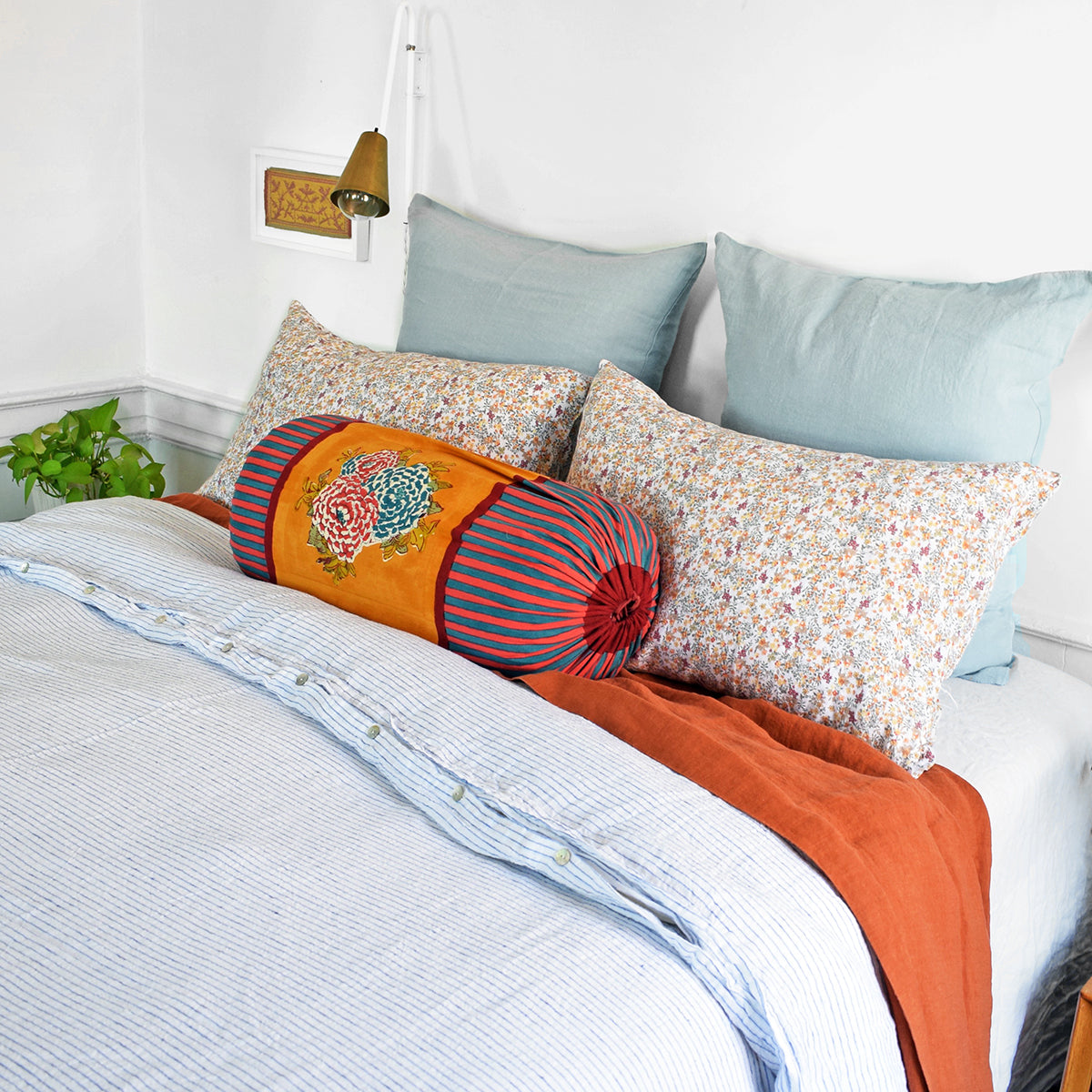 A Linge Particulier Linen Duvet in Atlantic Blue Stripe gives a white and blue pinstripe color to this duvet for a sky blue patterned and printed linen bedding look from Collyer's Mansion