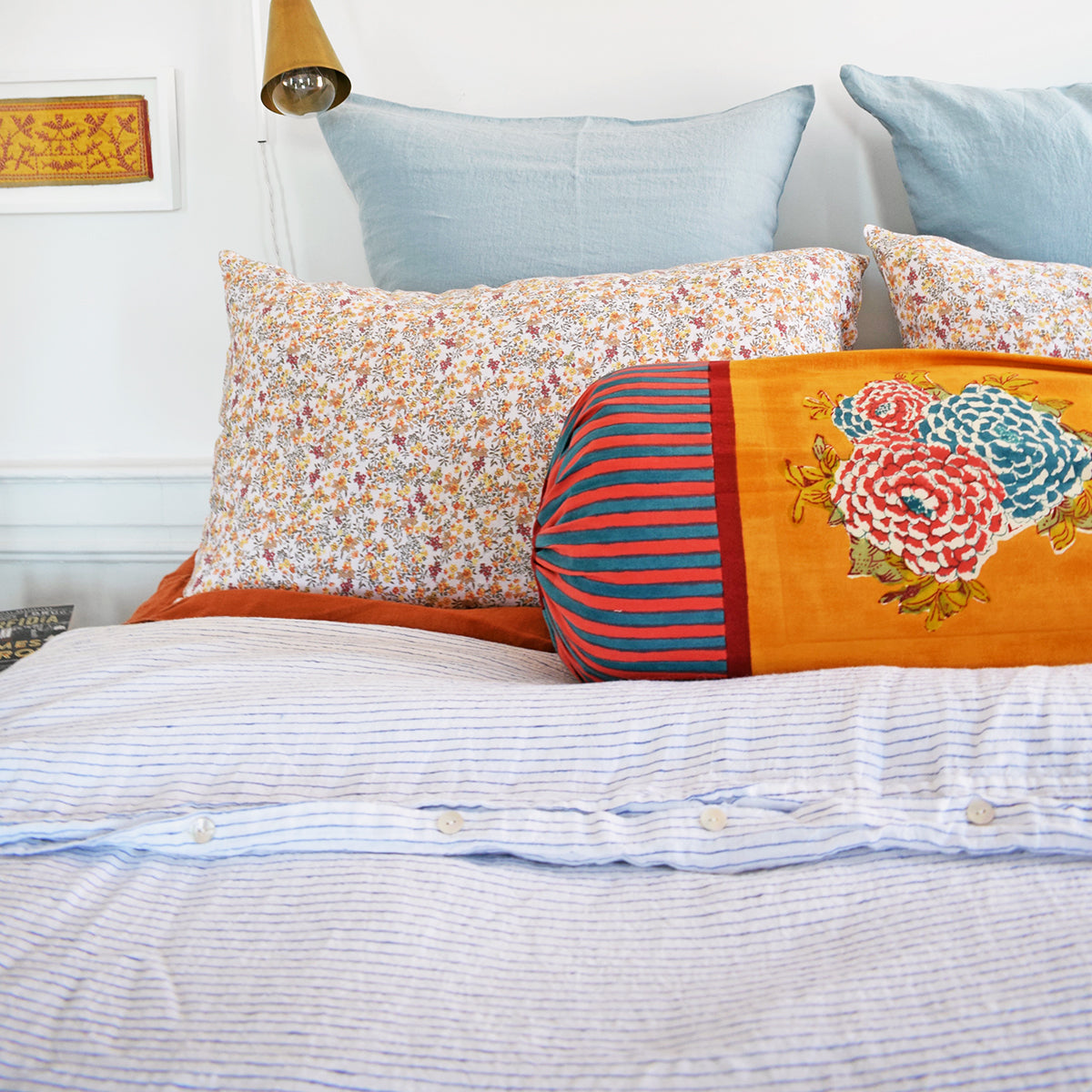 A Linge Particulier Linen Duvet in Atlantic Blue Stripe gives a white and blue pinstripe color to this duvet for a sky blue patterned and printed linen bedding look from Collyer's Mansion