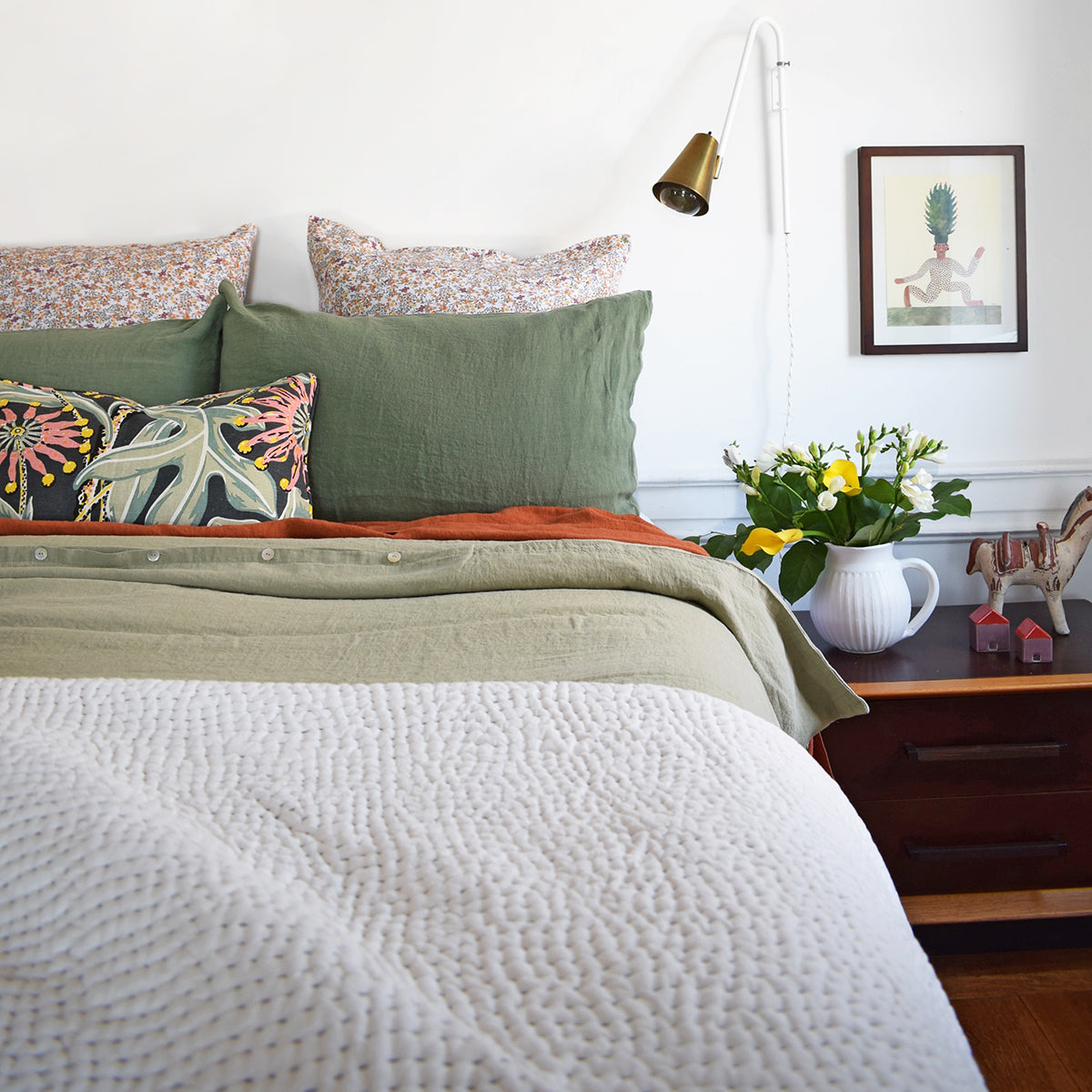 Linge Particulier Jade Green Standard Linen Pillowcase Sham with a stitched Indian quilt and green Utopia Goods pillow for a colorful linen bedding look in camo green - Collyer&#39;s Mansion