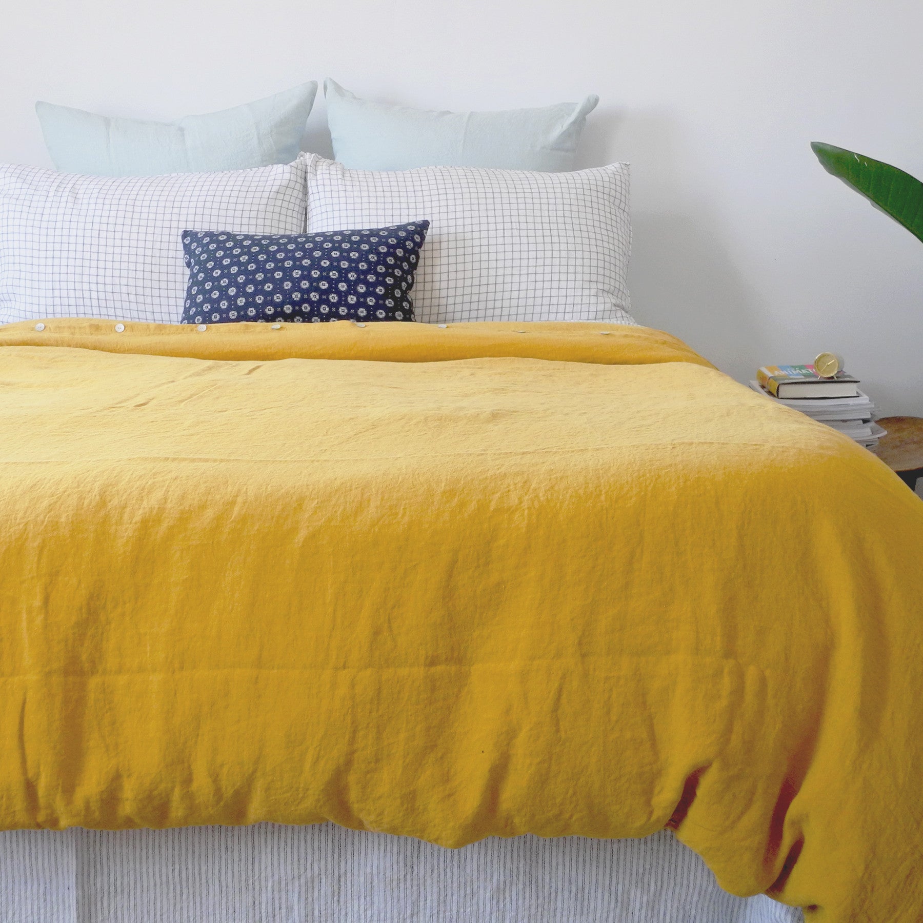 A Linge Particulier Linen Duvet in Honey gives a mustard and yellow color to this duvet for a colorful linen bedding look from Collyer's Mansion