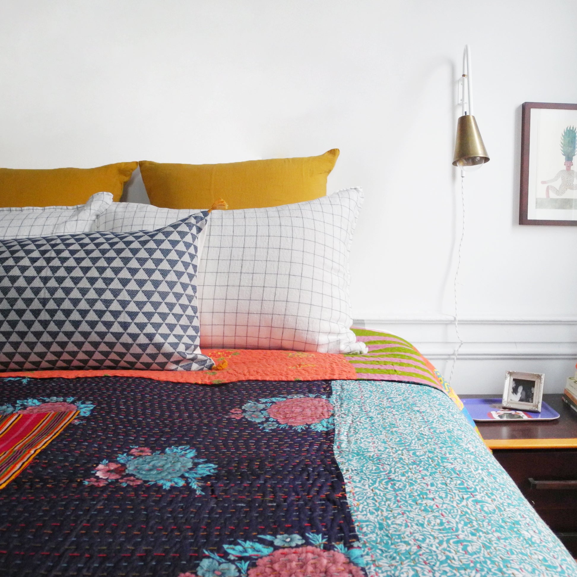 Linge Particulier Honey Yellow Euro Linen Pillowcase Sham with a Lisa Corti Gudri Kantha quilt for a colorful linen bedding look in mustard yellow - Collyer&#39;s Mansion
