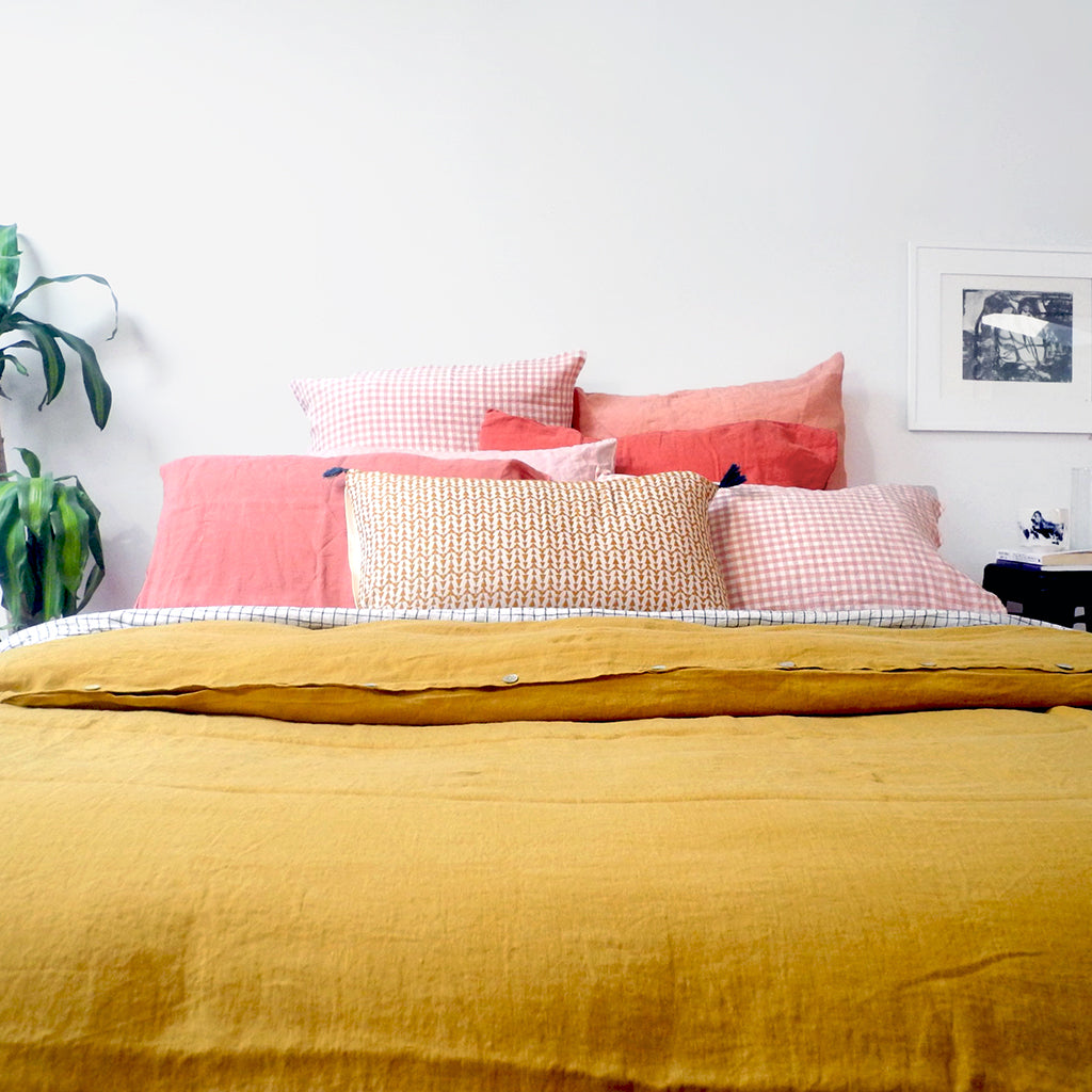 A Linge Particulier Linen Duvet in Honey gives a mustard and yellow color to this duvet for a colorful linen bedding look from Collyer&#39;s Mansion