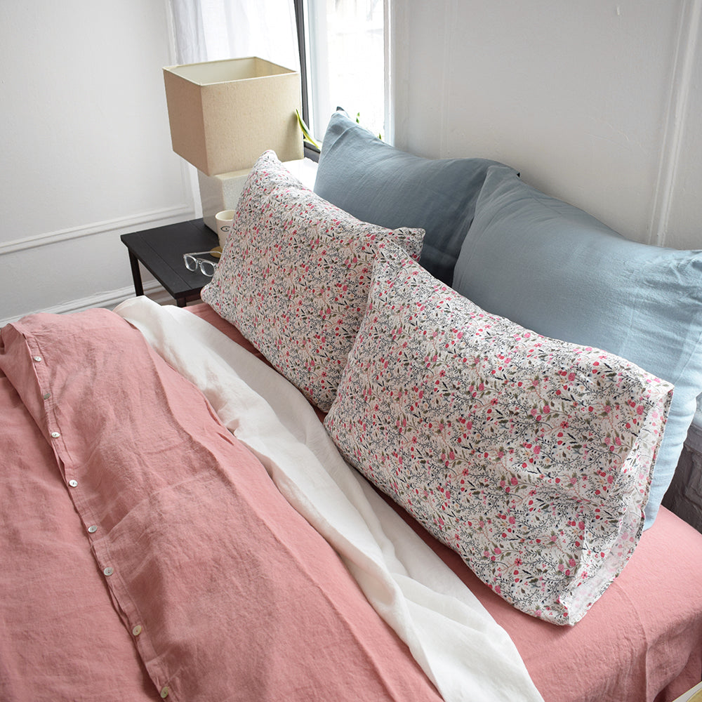 A Linge Particulier Linen Duvet in Lychee gives a deep salmon and old pink color to this duvet for a colorful linen bedding look from Collyer's Mansion