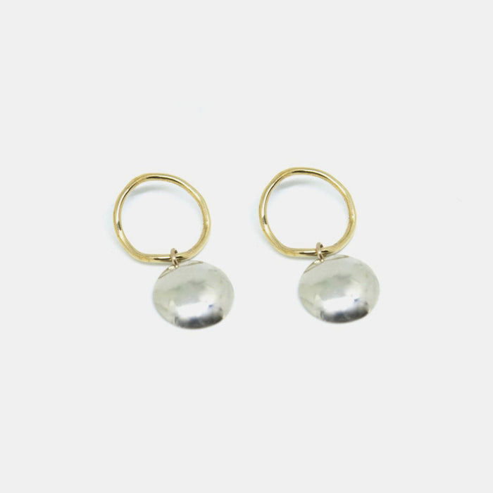 Slantt Petite Pilar Earrings are beautiful brass hoops with sterling silver domes and are the perfect statement earrings - Collyer's Mansion