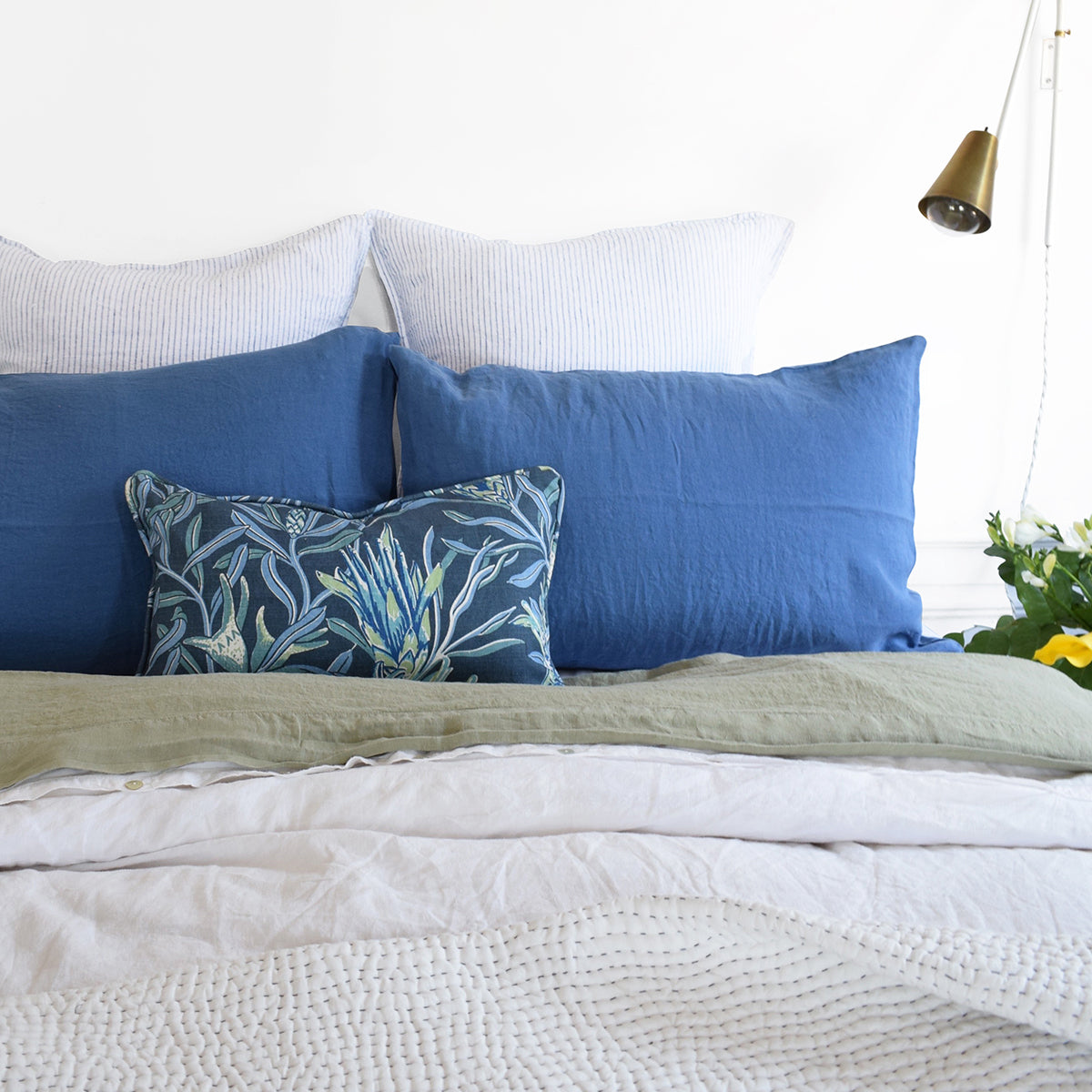 Linge Particulier Atlantic Blue Standard Linen Pillowcase Sham with Utopia Goods pillow and green linen sheet for a colorful linen bedding look in electric blue - Collyer&#39;s Mansion