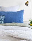 Linge Particulier Atlantic Blue Standard Linen Pillowcase Sham with Utopia Goods pillow and blue stripe euro shams for a colorful linen bedding look in electric blue - Collyer's Mansion