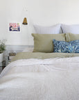 Linge Particulier Fennel Green Standard Linen Pillowcase Sham with Utopia Goods pillow and blue stripe euro shams for a colorful linen bedding look in olive green - Collyer's Mansion