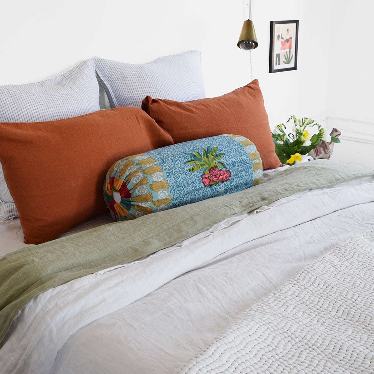 Linge Particulier Sienna Orange Standard Linen Pillowcase Sham with Lisa Corti bolster pillow and blue stripe euro shams for a colorful linen bedding look in burnt orange - Collyer&#39;s Mansion
